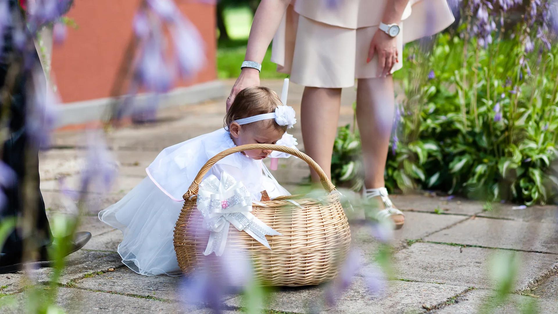 A young child in a Christening dress.