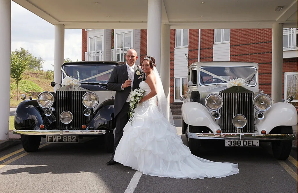 A newly married couple taking pictures at The Arden Hotel.