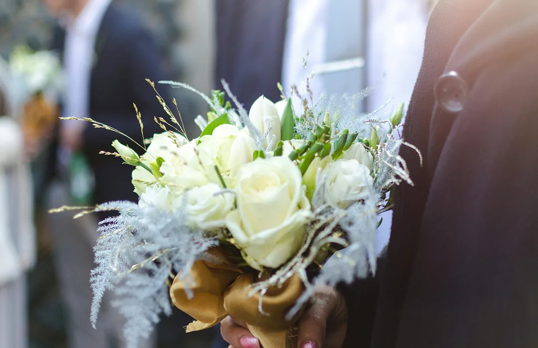 A vibrant bouquet held at a wedding – perhaps in our stylish wedding venue in Solihull.