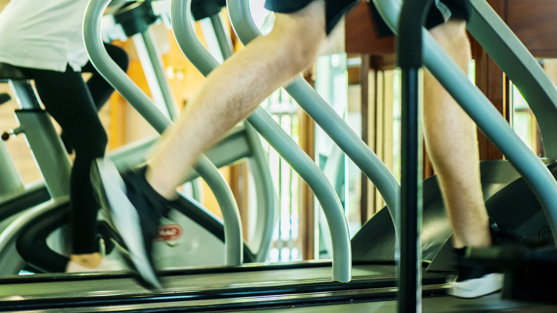A person running on the treadmill at the Arden Hotel Leisure Club.